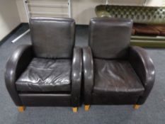 A pair of contemporary brown leather armchairs