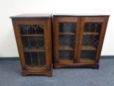 A double door bookcase with leaded glass door together with a matching hifi cabinet in oak finish