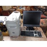 A Macintosh G4 quicksilver computer with Apple keyboard, 8 GB RAM,