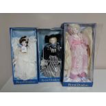 Three Royal Doulton Nisbet Collection dolls in boxes.