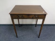 An Edwardian side table fitted with two drawers