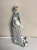A Lladro figure, lady holding a goose.