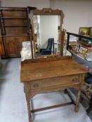 A twentieth century oak dressing table on bobbin legs