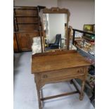 A twentieth century oak dressing table on bobbin legs