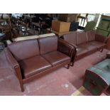 A contemporary three seater and two seater settee in brown leather