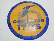 A reproduction circular Goodyear tyres sign