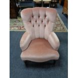 A Victorian style lady's chair upholstered in a pink buttoned dralon