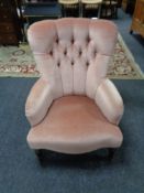 A Victorian style lady's chair upholstered in a pink buttoned dralon