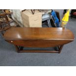 A narrow drop leaf coffee table