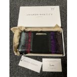 An Amanda Wakeley leather clutch purse, in retail dust cover and box.