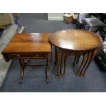 A nest of three pie crust edge occasional tables together with a mahogany flap sided sofa table
