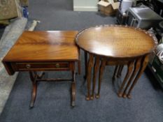 A nest of three pie crust edge occasional tables together with a mahogany flap sided sofa table