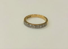 An 18ct gold diamond set half eternity ring, size M CONDITION REPORT: 3.