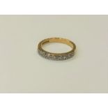 An 18ct gold diamond set half eternity ring, size M CONDITION REPORT: 3.