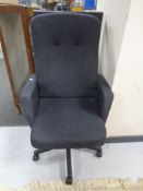 A high backed swivel office armchair