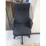 A high backed swivel office armchair