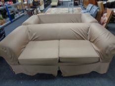 A pair of contemporary settees with loose covers