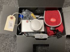 A Leica D-Lux 2 pocket-sized digital camera, with lens cap, with red Leica carry case, boxed.