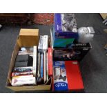 A box of books, annuals, DVD's, V-3 racing wheel,
