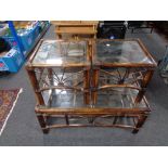 A banjo and wicker glass topped coffee table together with a pair of matching side tables