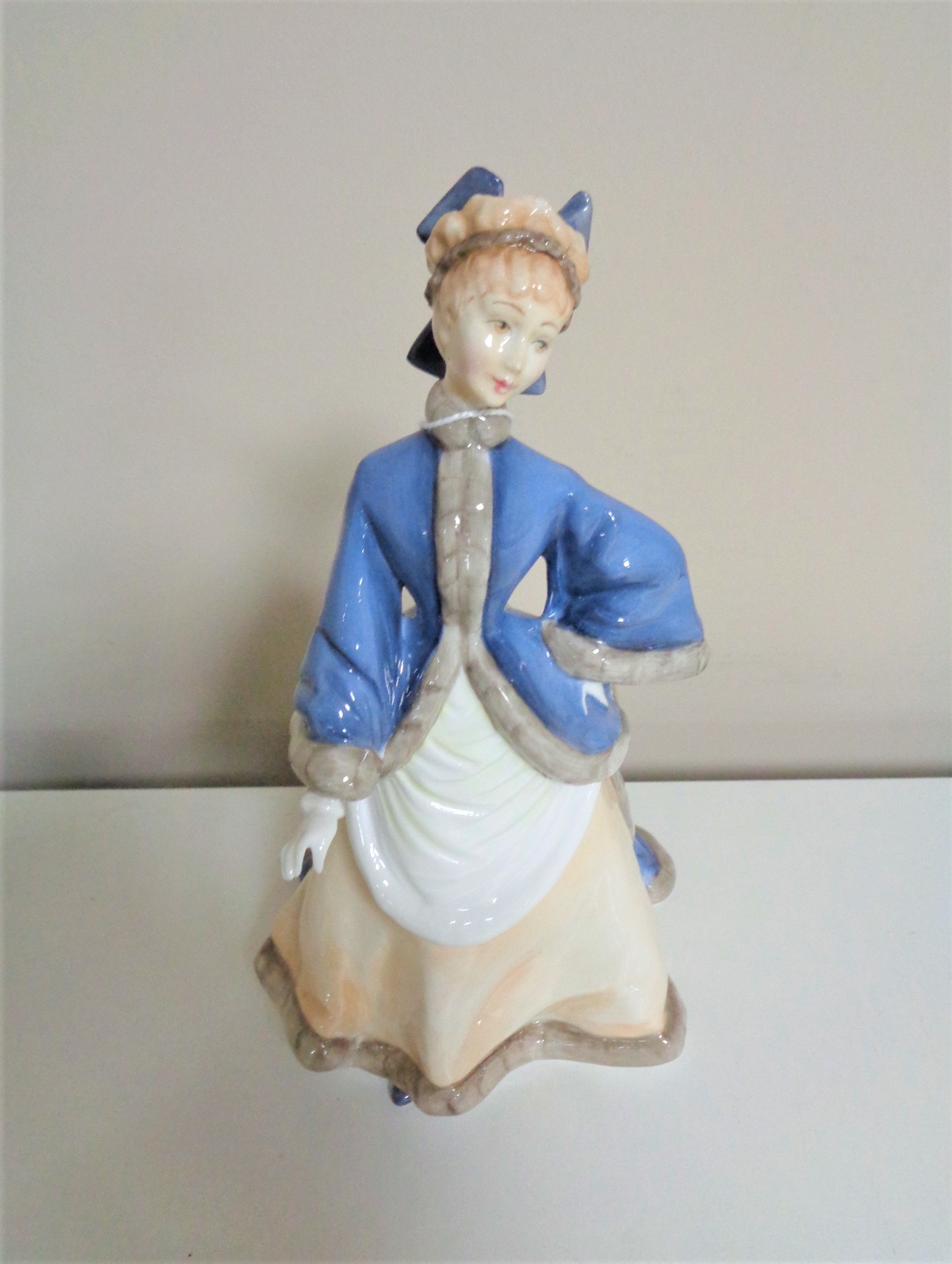 A Royal Worcester figure, Winters Morn.