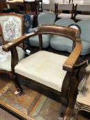 An early twentieth century oak armchair