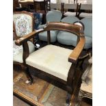 An early twentieth century oak armchair