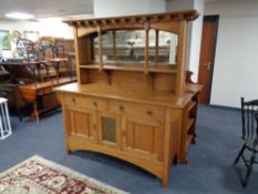 An oak Arts and Crafts mirror backed sideboard with inset copper panel CONDITION REPORT: