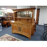 An oak Arts and Crafts mirror backed sideboard with inset copper panel CONDITION REPORT: