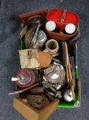 A box of binoculars, religious items, clothes brushes,