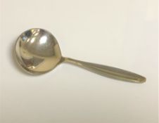 A Georg Jensen silver caddy spoon