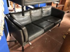 A Danish black leather three seater settee