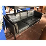 A Danish black leather three seater settee