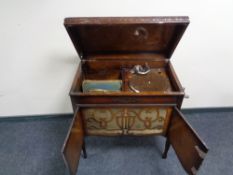 An Meritone radiogram in cabinet together with a quantity of 78's