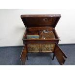 An Meritone radiogram in cabinet together with a quantity of 78's