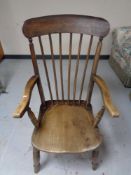 An elm stick backed kitchen armchair