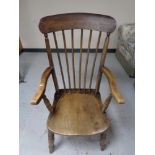 An elm stick backed kitchen armchair