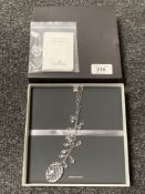 A Waterford Crystal and sterling silver necklace, in retail box.