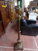 An early twentieth century brass floor lamp CONDITION REPORT: This has continental