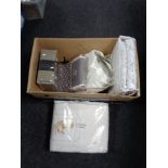 A box of new bedding including Kelly Hoppen,