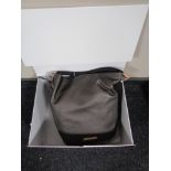 An Amanda Wakeley lady's bag, with dust cover and retail box.