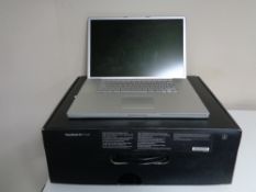 An Apple Power Book G4 laptop with 17" screen