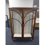 A twentieth century oak double door display cabinet CONDITION REPORT: 87cm wide by