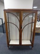 A twentieth century oak double door display cabinet CONDITION REPORT: 87cm wide by