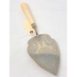 Morpeth Interest : A large silver plated slice with turned ivory handle,