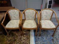 Three contemporary bentwood armchairs in floral fabric