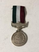 An Eastern medal on ribbon