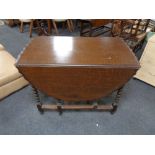 An Edwardian oak barleytwist gateleg table