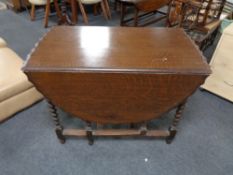 An Edwardian oak barleytwist gateleg table