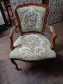 A reproduction tapestry seated armchair